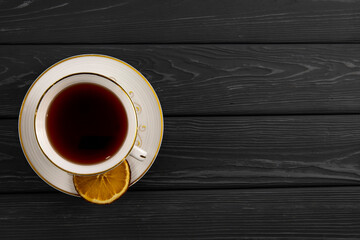 Cup of tea on a wooden table. Top view.