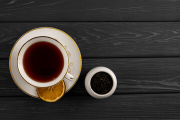 Cup of tea on a wooden table. Top view.