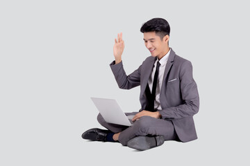Young asian business man sitting work on laptop computer to internet online isolated on white background, businessman confident and notebook, freelance with success, marketing and communication.