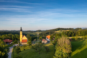 Germany, Bavaria, Irschenberg, Drone view o fChurch of Blessed Virgin Mary's Birth and surrounding landscape
