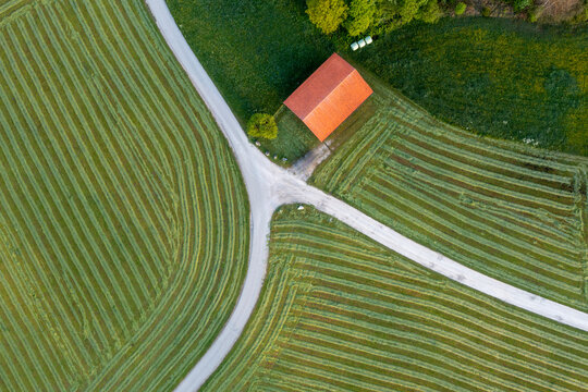 Drone view of green freshly mowed field