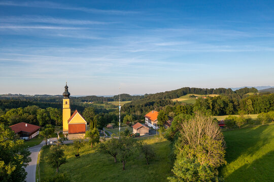 Germany, Bavaria, Irschenberg, Drone view o fChurch of Blessed Virgin Mary's Birth and surrounding landscape