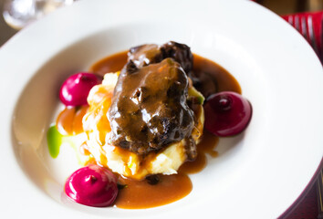 beef cheek with mashed potatoes and currant oil