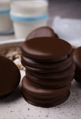 Tasty choco pies in plate, closeup view