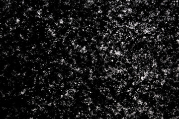 white icy snowflakes isolated on black background, natural background