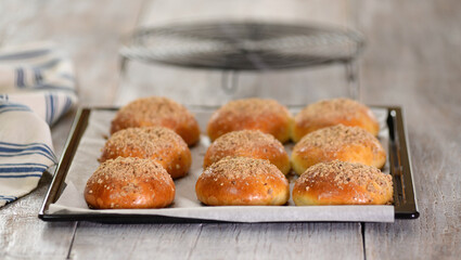 Freshly Baked Sweet Yeast Buns On A Baking Sheet.