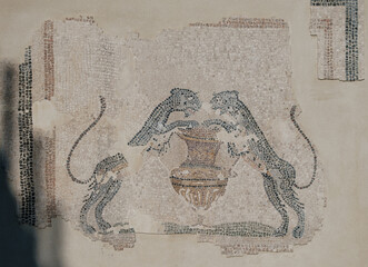 Mosaic depicting two panthers drinking from a krater used to mix wine with water, from Sardinia, 2nd-3rd century AD. Mosaic tile background. Mosaic wall in antique style. © Aloshin Evgeniy