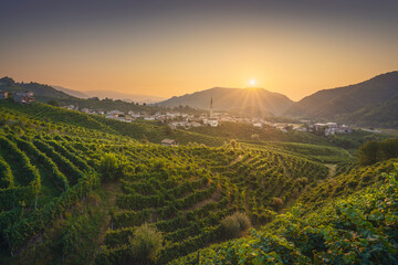 Prosecco Hills, vineyards and Guia village at dawn. Unesco Site. Valdobbiadene, Veneto, Italy
