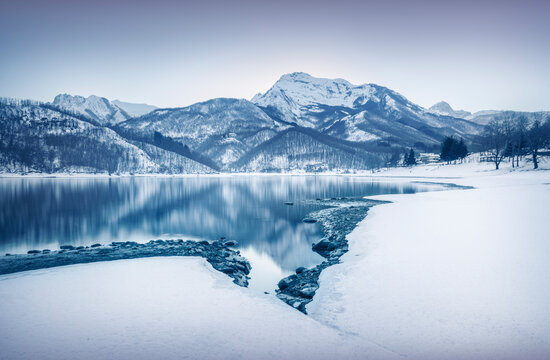 Gramolazzo lake and snow in Apuan mountains. Garfagnana, Tuscany, Italy