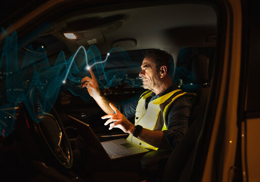 Engineer touching augmented waves in car