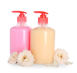 Obraz na płótnie Canvas Dispensers with liquid soap and roses on white background
