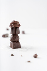 Chocolate candies in a cut on a white background