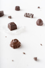 Chocolate candies in a cut on a white background