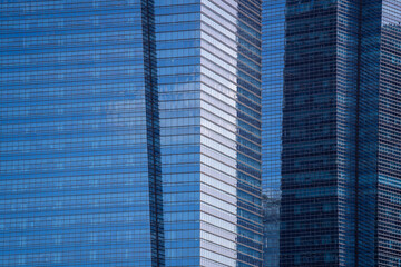 High glass skyscrapers on the streets of Singapore. Office windows background, closeup