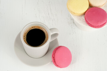 macarons and cup of coffee on table