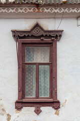 Authentic decorated red window with openwork pattern