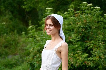 Naklejka premium Woman in white dress in the village outdoors Green grass Farmer