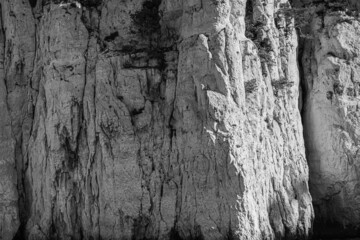 close up on the rock of a mountain in black and white