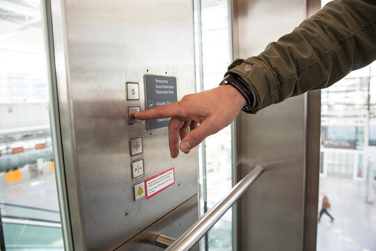 Man pressing button in elevator