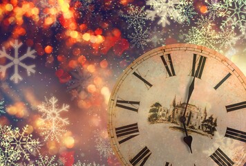 Fototapeta na wymiar 2022 New Year concept with Clock And Fireworks, Golden Abstract Defocused Background