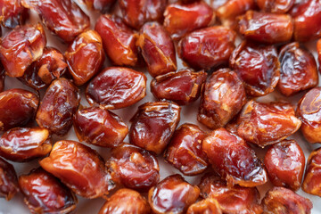 High Fiber Date Fruits. Top view of dried dates displayed on a spice bazaar. Full of fiber, potassium, magnesium, copper, manganese, iron and vitamins.
