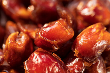 Top view of juicy Dates. Close-up of date palm fruit on a traditional market. Healthy dried fruits background concept.