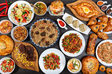 The concept of Eastern asian festive cuisine. Assorted Uzbek food set, pilaf, samsa, lagman, manti, shurpa restaurant concept Eastern arabic new year and Christmas dish from lamb served cookware.