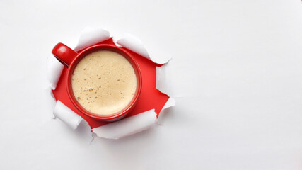 A cup of coffee in a paper frame