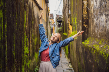 Woman tourist on background of Hoi An ancient town, Vietnam. Vietnam opens to tourists again after quarantine Coronovirus COVID 19