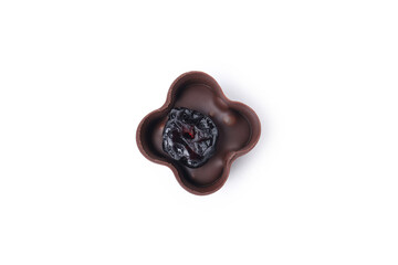 Chocolate candy with raisin isolated on white background