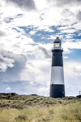 Fototapeta na wymiar Dramatic sky and lighthouse