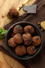 Concept of sweets with truffles on wooden background