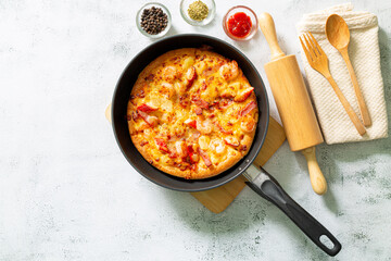 Pizza,Delicious pepperoni pizza and basil tomato cooking ingredients on black concrete background, top view of hot pepperoni pizza. With copy space for text lay flat, banner.