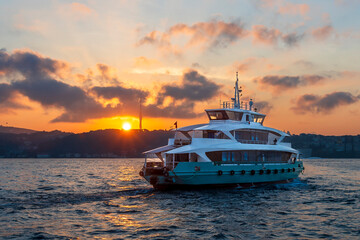 Ferry is on The Bosphorus at sunrise in Istanbul