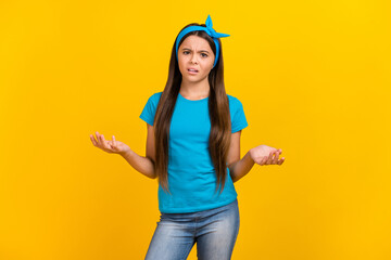 Photo of young pretty lady negative angry questioned misunderstanding isolated over yellow color background