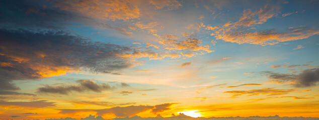 Obraz na płótnie Canvas clouds and orange sky,Real panoramic sunrise sundown sky with gentle colorful clouds. Big size
