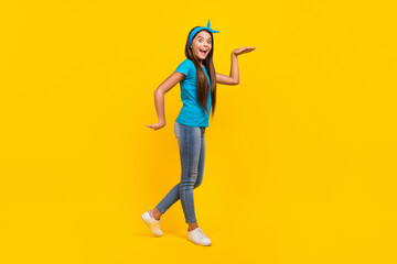 Fototapeta na wymiar Full body profile side photo of young lovely lady have fun walk playful dancer isolated over yellow color background
