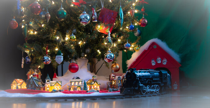 Nice Toy Train Under The Christmas Tree. Magog