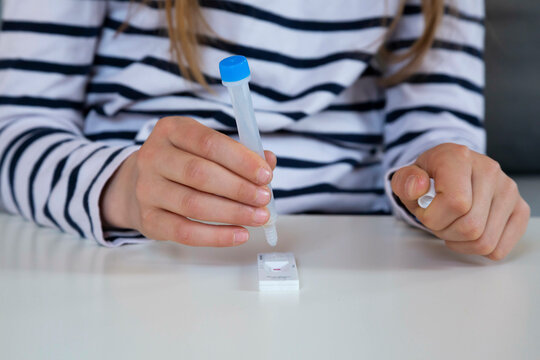 Girl With Testing Kit Analyzing Coronavirus