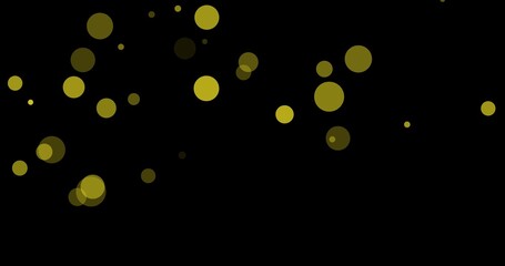 Digitally generated image of gold colored bokeh effect against black background with copy space