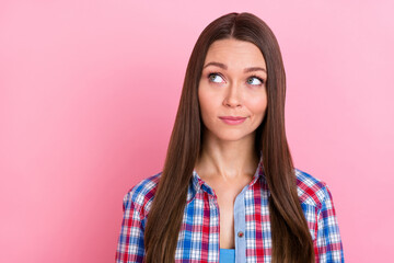 Fototapeta premium Photo of unsure brunette millennial lady look empty space wear blue shirt isolated on pastel pink color background