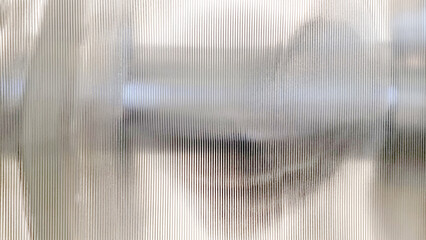 Fototapeta close up polycarbonate sheet wall with lighting for interior partition. frosty glass polycarbonate sheet texture. transparent material named corrugated glass surface. obraz