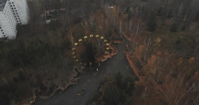 Ferris wheel in Abandoned city Chernobyl nuclear zone Pripyat aerial footage