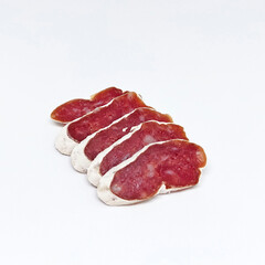 Delicious sliced ​​salami in white mold