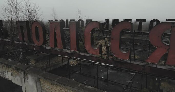 Close up dron shot of  inscription on the roof of an abandoned hotel Polissya in the ghost town of Chernbyl Pripyat. Exclusion Zone