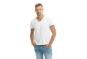 Serious handsome guy in white tshirt keep hands in jeans pockets isolated on white, casual