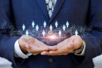Businessman hand support human resources on blurred background.