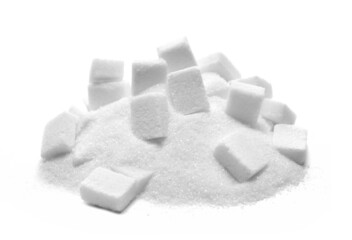 Pile sugar cubes isolated on white background