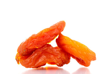 Bright orange organic dried apricots, close-up, isolated on white.