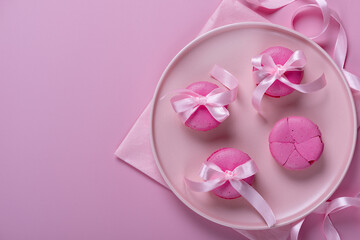 Pink macaroons on pink background. Sweet background. Flat lay, top view, copy space